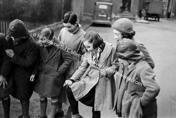 THE CHAMPION  PLAYING MARBLES